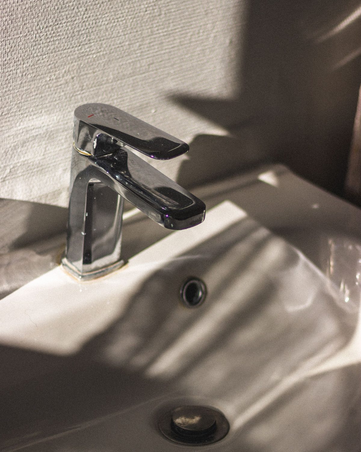 Chrome single-handle mixer tap, close up