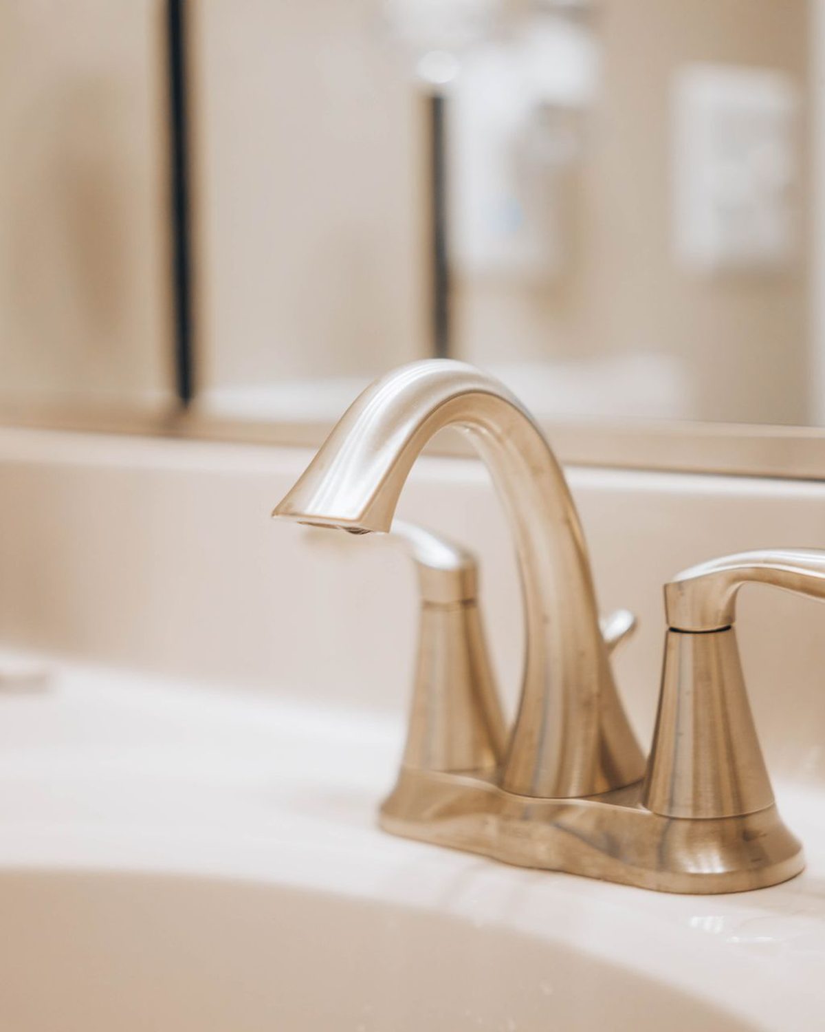 Stainless steel tap on a white basin